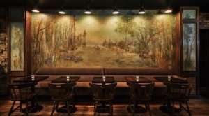 Indoor seating area with large mural at the Bayou Bar in New Orleans, LA
