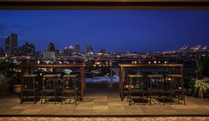 Two tables with six bar height stools overlooking the city on the Roof top of our hotel in New Orleans