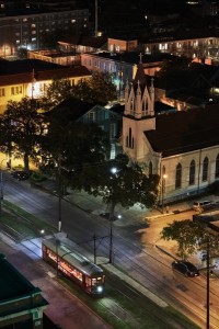 Trolly, church and surrounding areas near the Pontchartrain hotel at night.