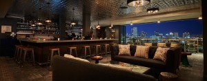 Sofas and a bar in an open-air rooftop bar in New Orleans