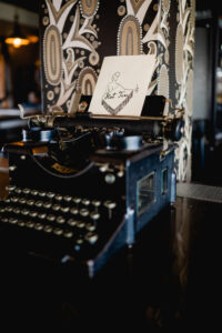 "Hot Tin" bar logo in a typewriter at Hot Tin in New Orleans