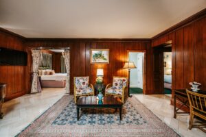 Living area in one of our NOLA suites, with doors to multiple bedrooms