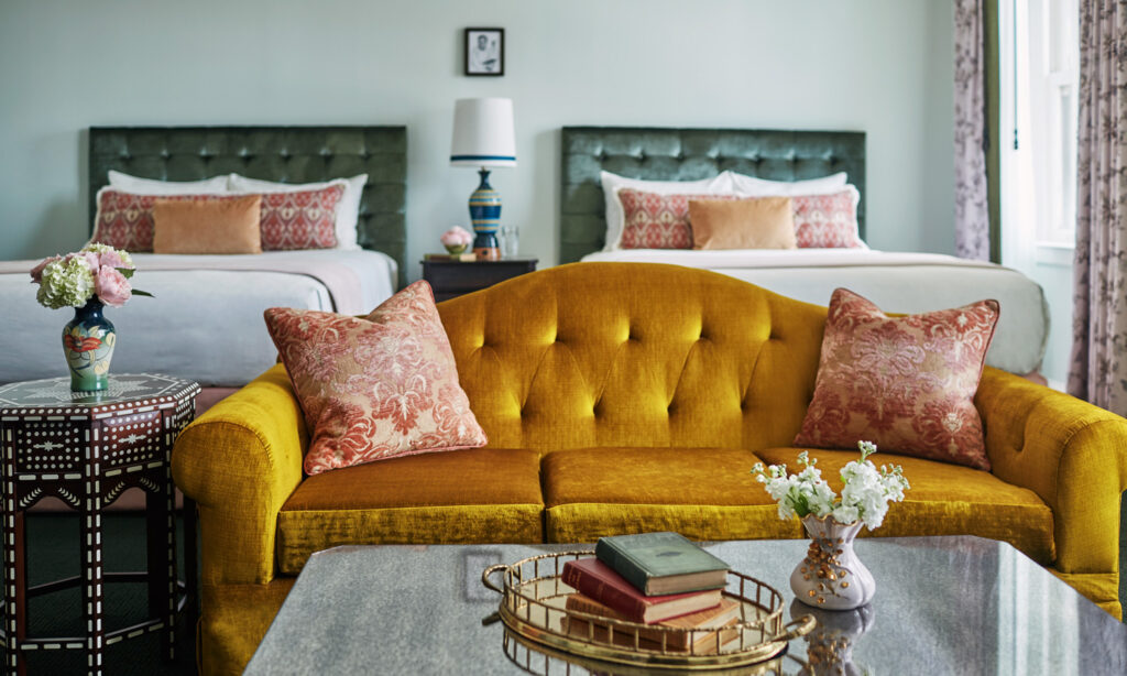 Sofa in front of two beds