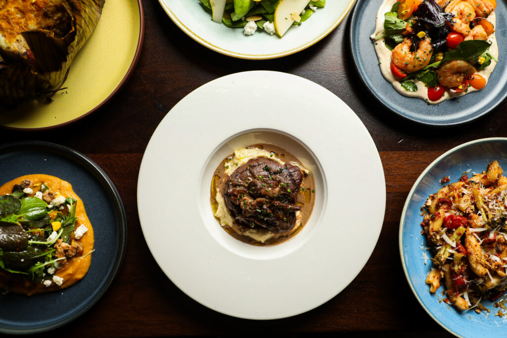 Various plates of food on a table