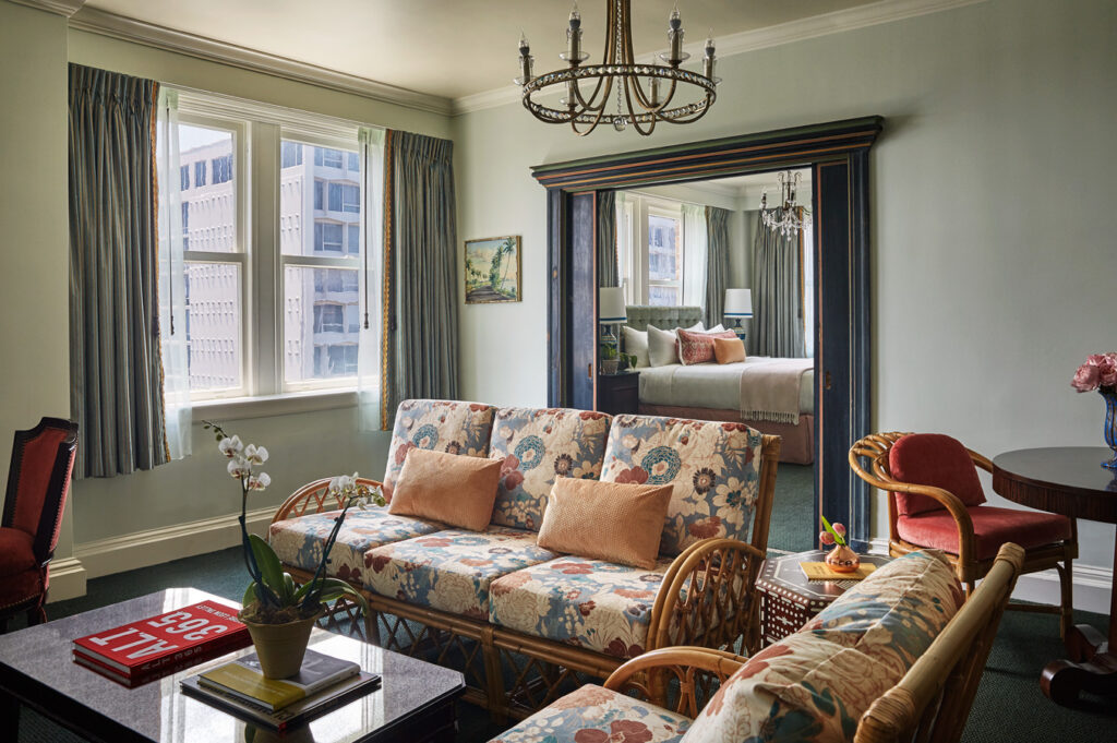Hotel suite with living area and bed area